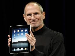 Steve Jobs with revolutionary tablet computer, the iPad.